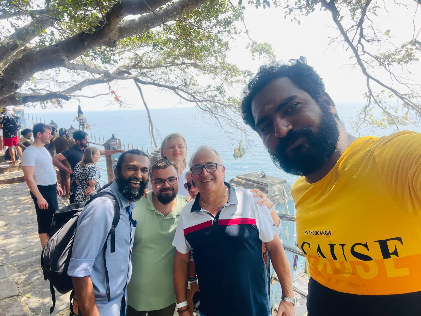 Guests and their driver at the cliff-top viewpoint by Koneswaram temple in Trincomalee